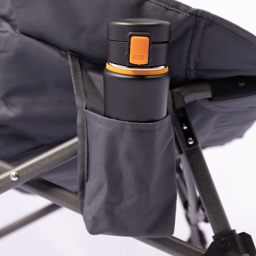 Close-up of a cup holder on the Vango Crater Camping Chair, adding convenience to this padded and comfortable outdoor chair.