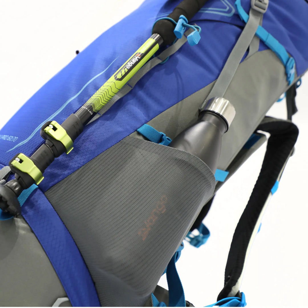 Detailed view of the Vango Denali Pro rucksack with a securely fastened trekking pole and water bottle, designed for hiking and Duke of Edinburgh expeditions.