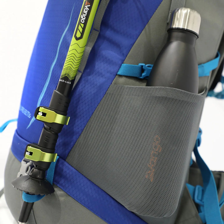 Side mesh pocket of the Vango Denali Pro 60:70S rucksack holding a water bottle, designed for DofE and outdoor expeditions.