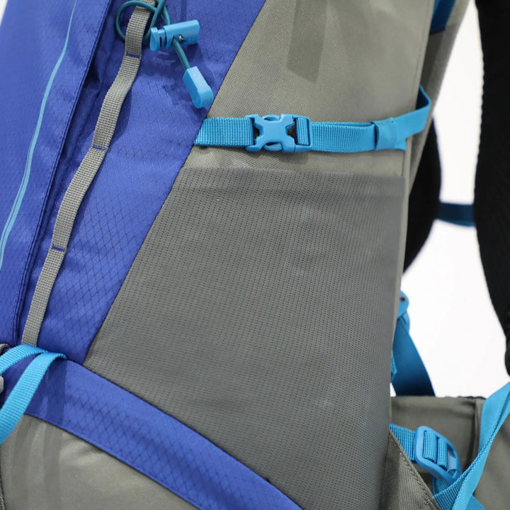 Side view of the Vango Denali Pro 60:70S rucksack, showing the spacious mesh pocket and adjustable straps, designed for DofE use.