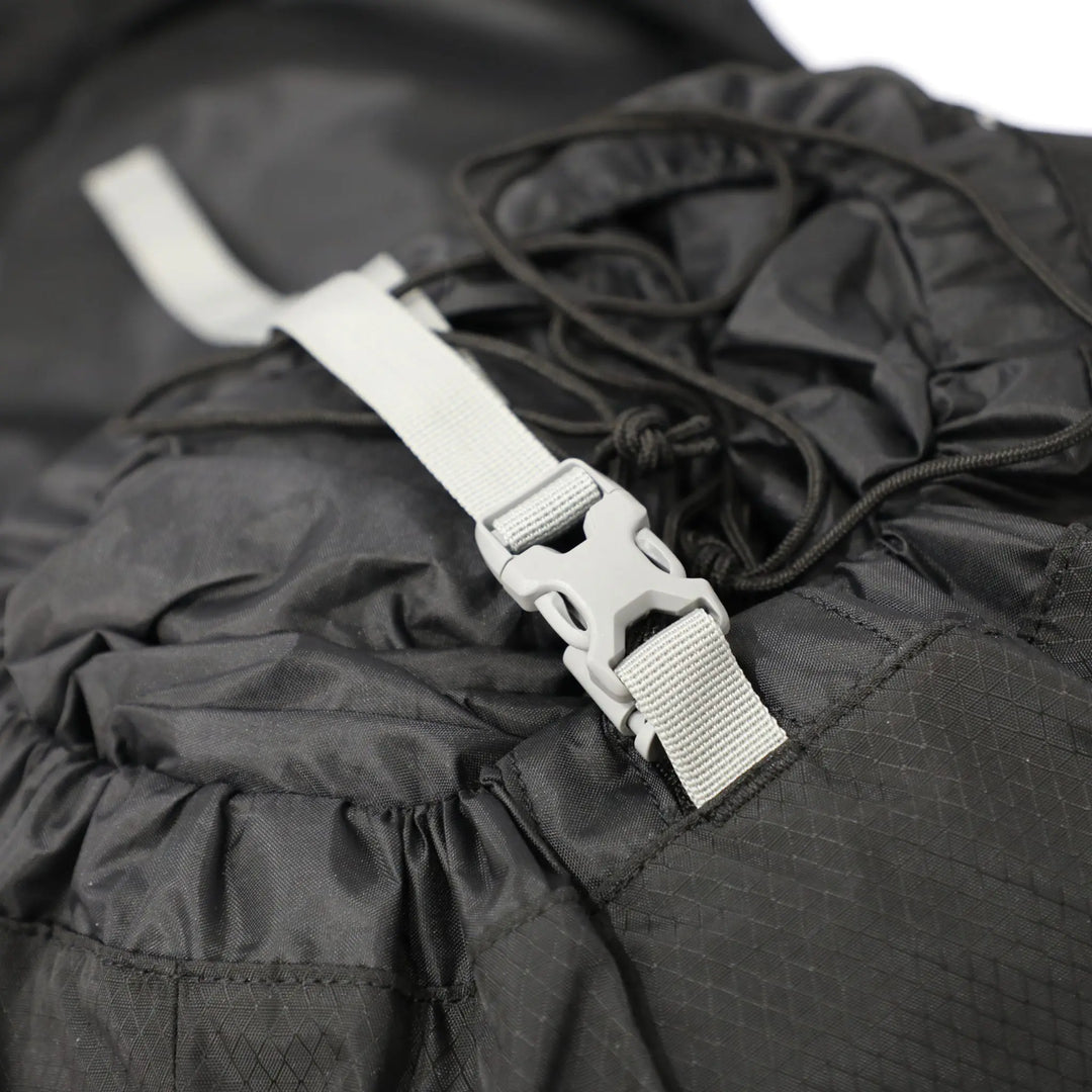 Compression strap and clip on the Vango Denali Pro 70:80 Rucksack for reducing bulk and stabilising hiking gear.