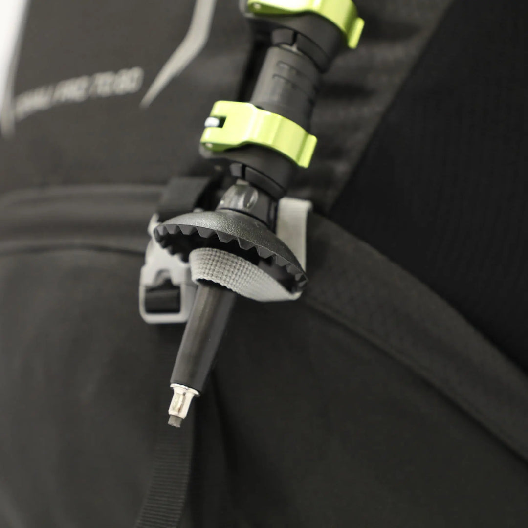 Close-up of the walking pole tip secured on the Vango Denali Pro 70:80 Rucksack during outdoor trekking.