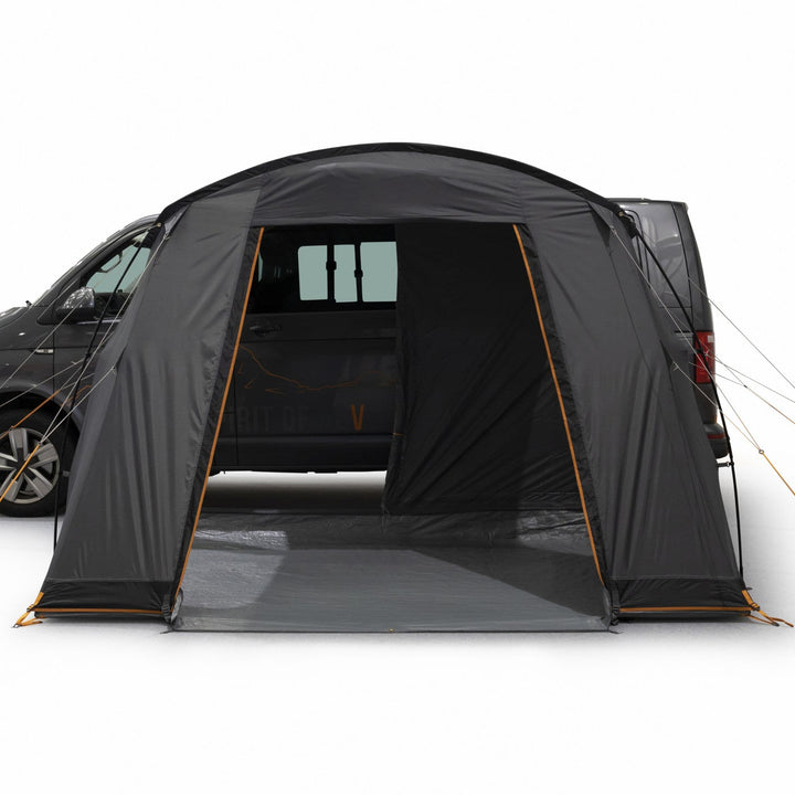 Vango Faros III Low (Poled) Drive Away Awning with the front door open, connected to a VW campervan for additional living space.