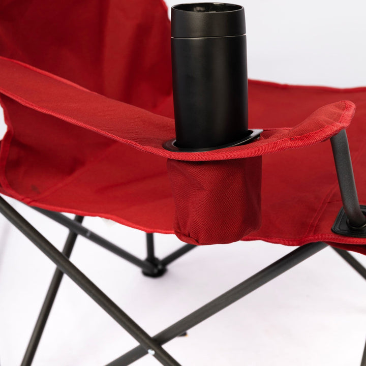 Close-up of the Vango Fiesta Chair’s armrest cup holder, holding a black bottle, ideal for convenient storage while relaxing outdoors.