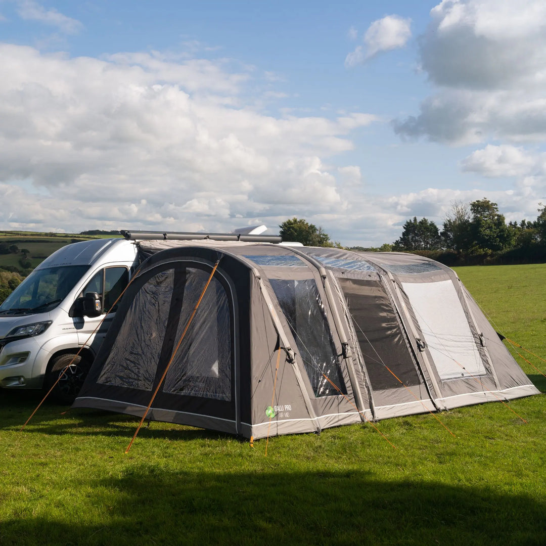 Vango Galli Pro AIR MID Drive-Away Awning pitched with its doors closed in a field