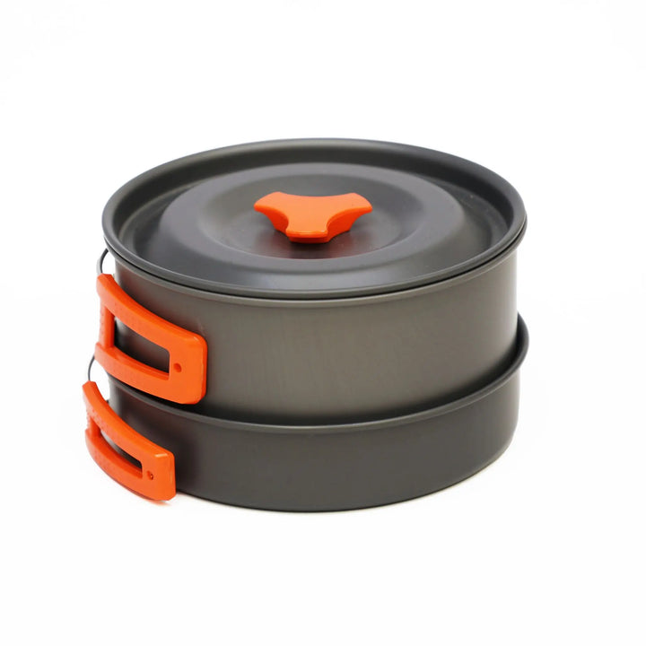 Compactly stacked Vango Hard Anodised 2 Person Cook Kit with orange handles, designed for camping and campervanning.