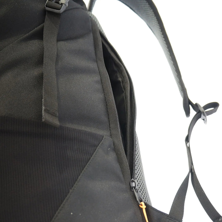 Side pocket of the Vango Hex Rolltop 25L backpack holding a reusable water bottle, ideal for outdoor activities.