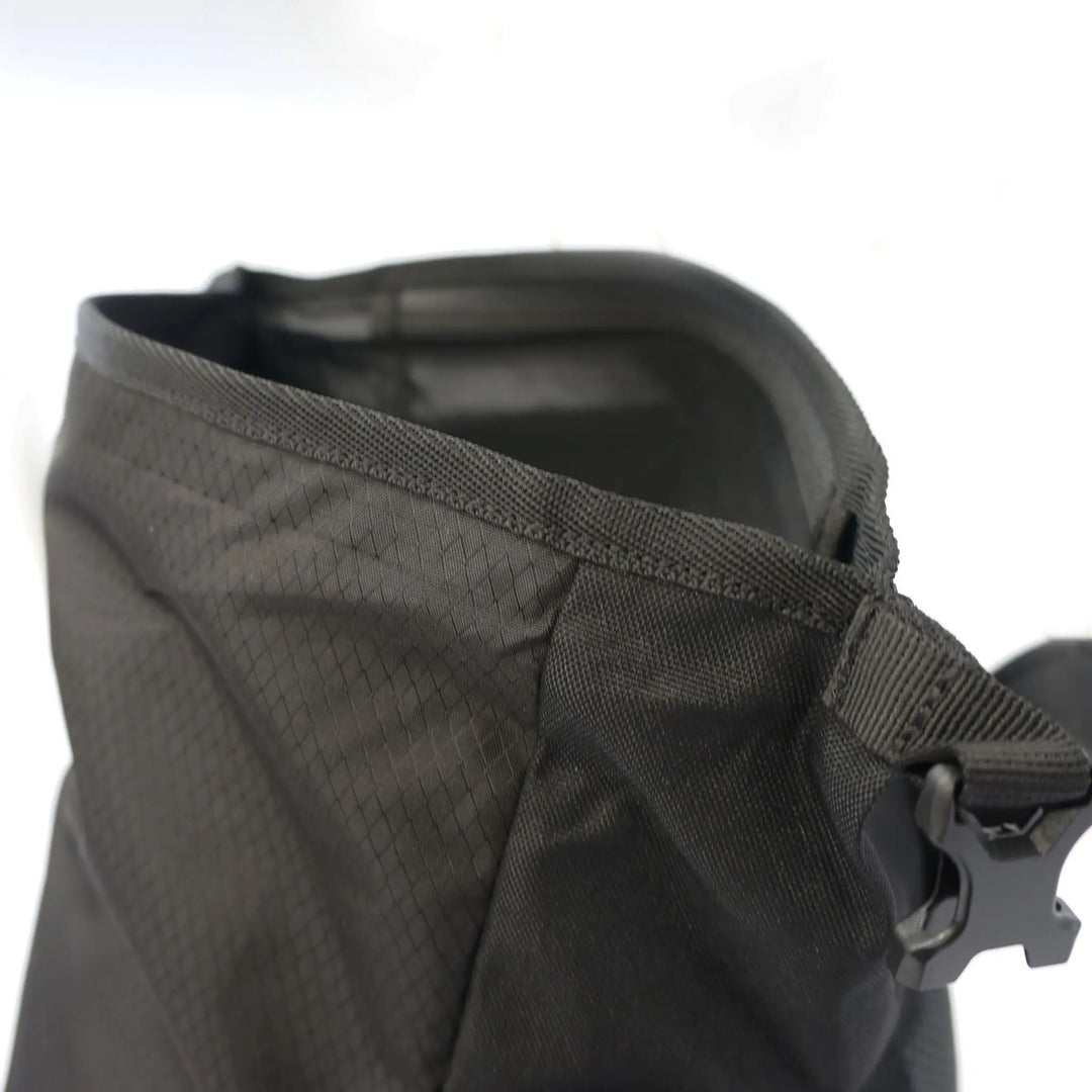 Close-up view of the rolltop opening on the Vango Hex Rolltop 25L backpack, highlighting the durable material and secure closure.