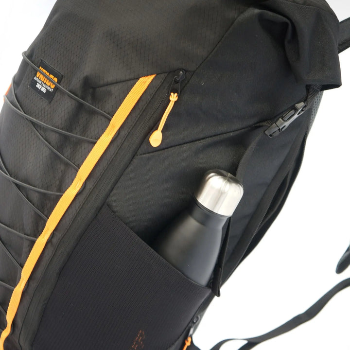 Side profile of the Vango Hex Rolltop 25L rucksack, featuring ergonomic straps and breathable mesh back padding.