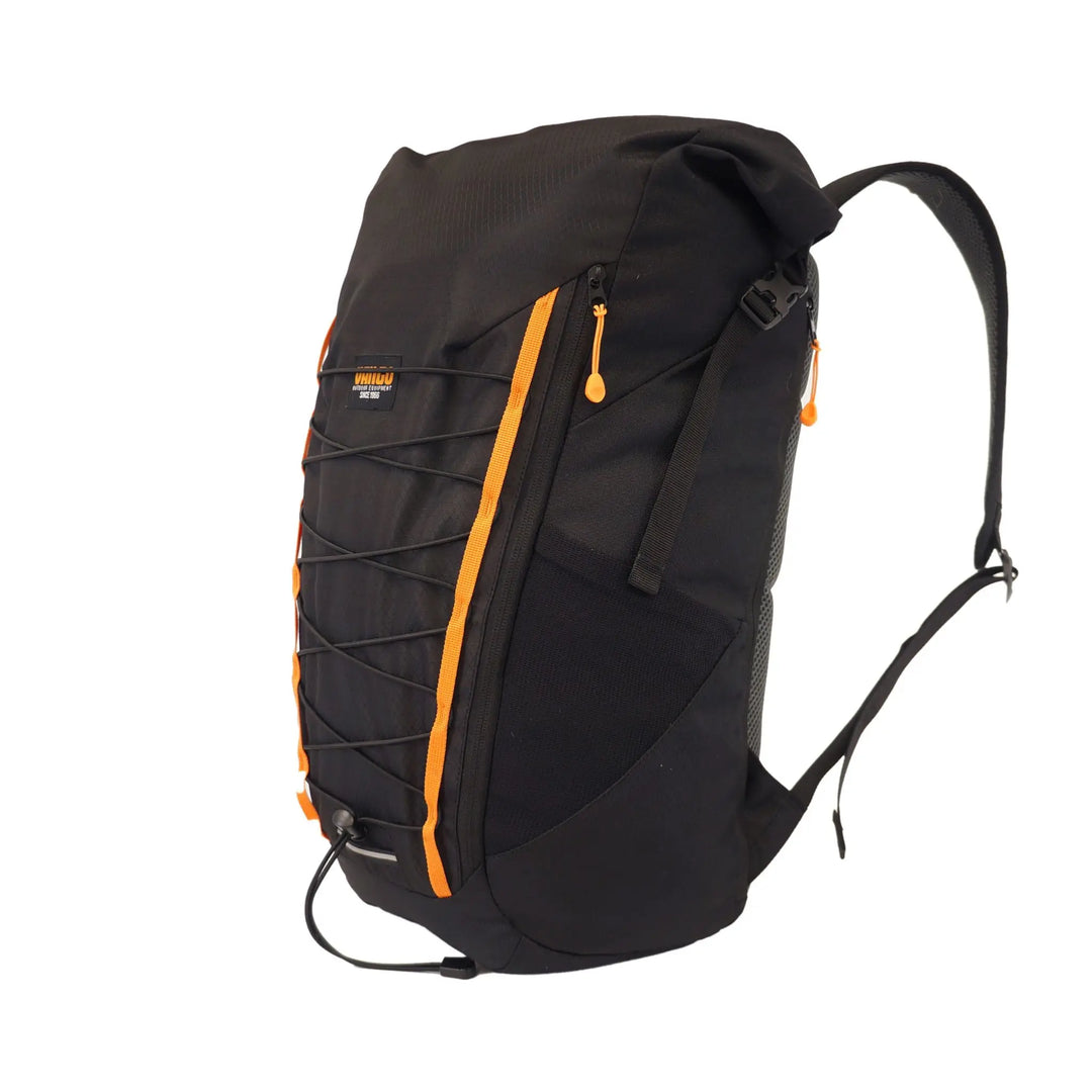 Side view of the Vango Hex Rolltop 25L rucksack in black with orange accents, showing adjustable straps and bungee cord detailing, ideal for hiking or everyday use.