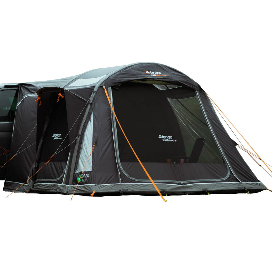 Vango Kela Pro Air Low drive-away awning attached to a campervan, with pre-angled beams and tensioned guy ropes for stability.