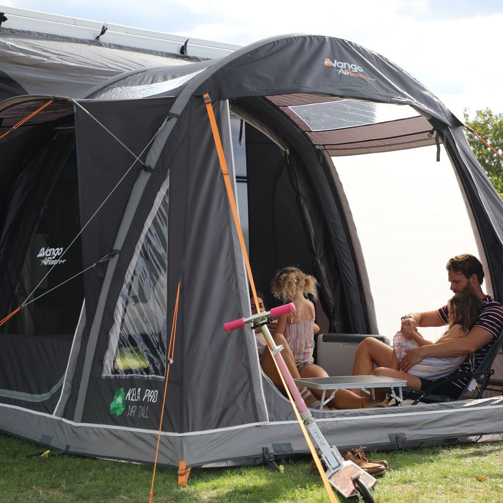 Exterior view of the Vango Kela Pro Air Tall Drive Away Awning, designed for motorhomes and campervans, featuring spacious living areas, Pre-angled Beams, and 6000HH fabric for ultimate weather protection.