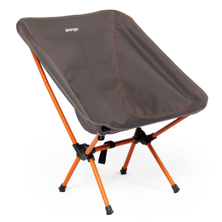 Front angled view of the Vango Micro Chair Excalibur, a lightweight camping chair with a compact, foldable design and grey fabric with orange steel legs.