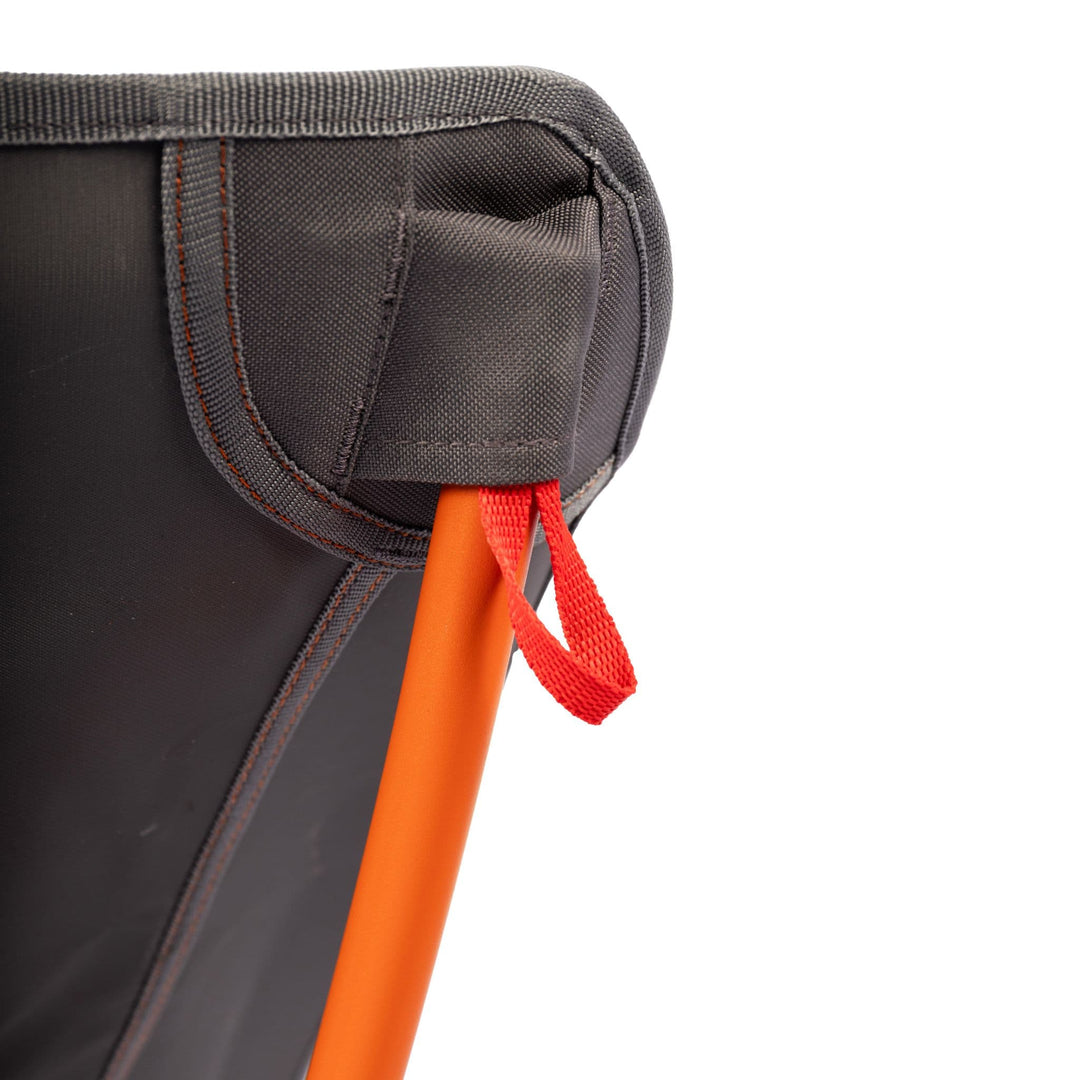 Red pull tab detail on the Vango Micro Lux Chair (Excalibur), making it easy to fold and carry.