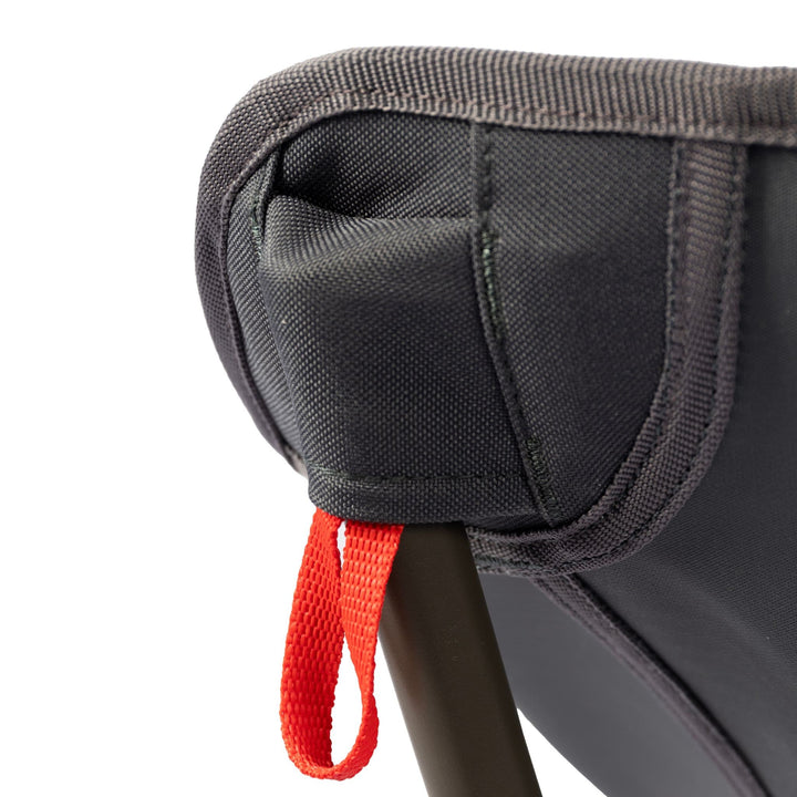 Close-up of the fabric and red strap attachment on the Vango Micro Lux Chair, emphasising the premium materials used in this lightweight camping chair.