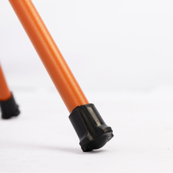 Detailed view of the Vango Micro Stool Excalibur leg and non-slip rubber foot, ensuring stability on various outdoor surfaces.