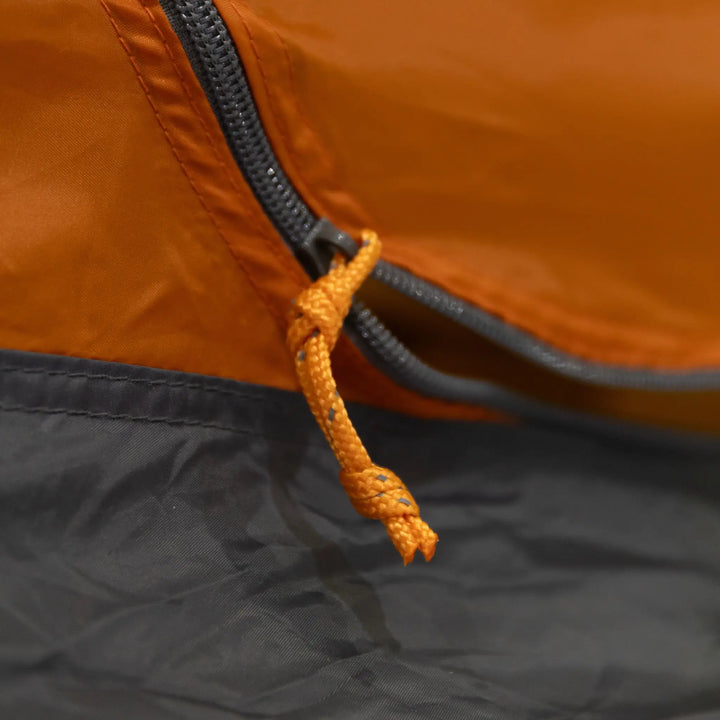 Detailed view of the orange zip pull on the inner tent of the Vango Nevis 300 tent, suitable for lightweight backpacking and trekking trips.