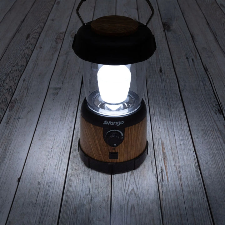 Vango Nova 200 Recharge Lantern lifestyle image with light turned on showing its brightness.