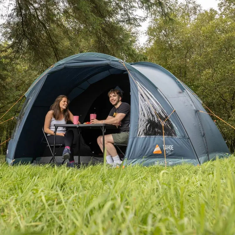 Vango poled tent pitched on a campsite in the UK.