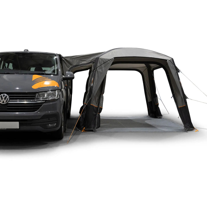 Vango Quadris Air Low Drive Away Awning attached to a VW campervan with all doors open.