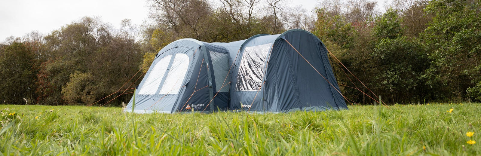 Outdoor view of the Vango Sentinel Side Awning's side profile, highlighting its large window and sleek design.