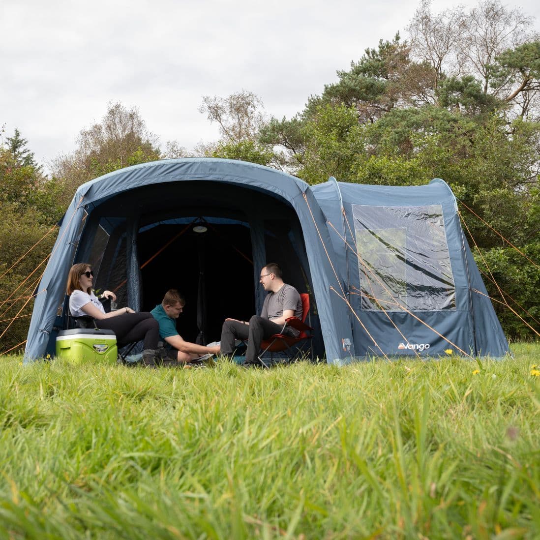 Lifestyle view of the Vango Sentinel Side Awning showcasing its spacious design and large windows.