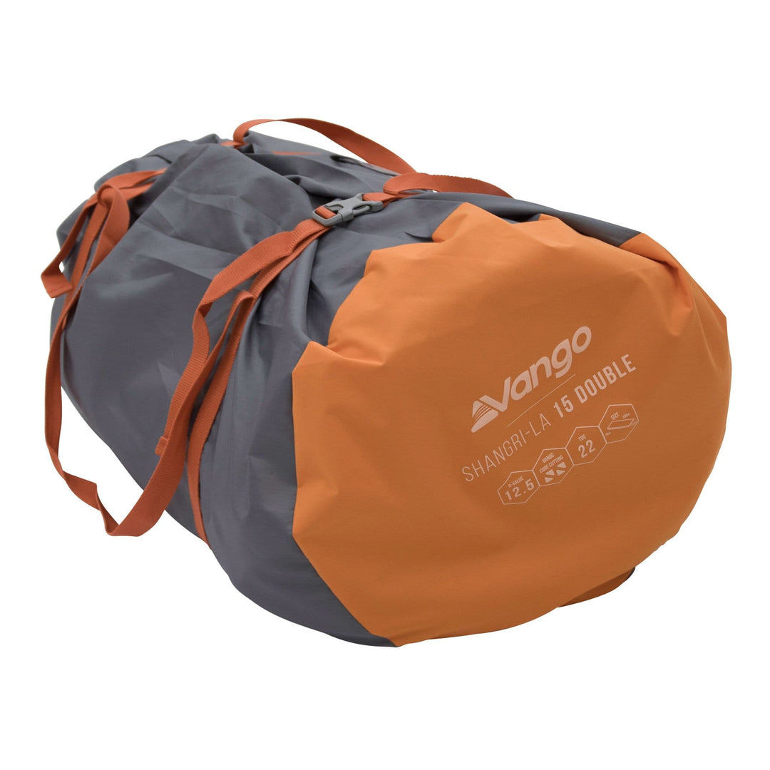 Vango Shangri-La II 15cm Double SIM rolled up in its compact carry bag with secure orange straps for easy transportation.