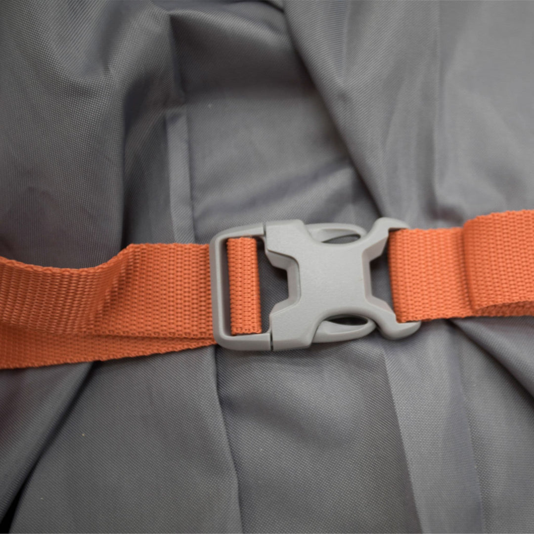 Close-up of the orange buckle strap on the Vango Shangri-La II 15cm Grande single Sim camping mat, designed for secure storage and portability.