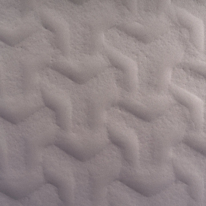 Close-up of textured gray fabric on the Vango Shangri-La Lux 16cm Grande Camping Mattress