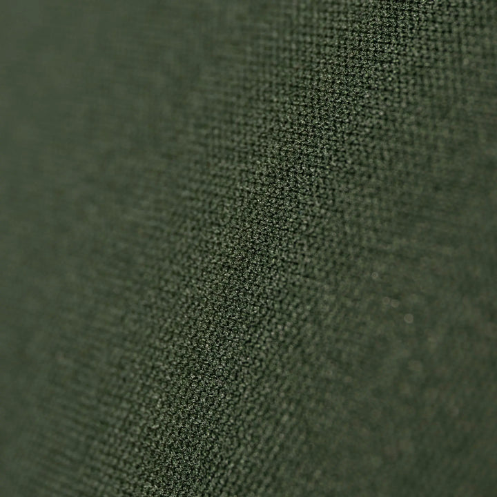 Close-up of green fabric texture on the Vango Shangri-La Lux 16cm Grande Camping Mattress