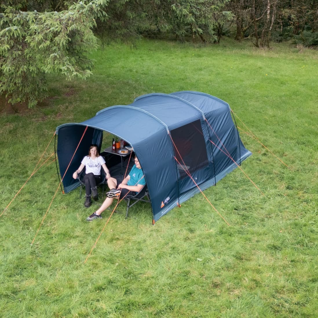 Overhead view of the Vango Sierra 300 Poled Tent pitched in a grassy field, showing its durable design and practical living space, suitable for a 3 man tent.