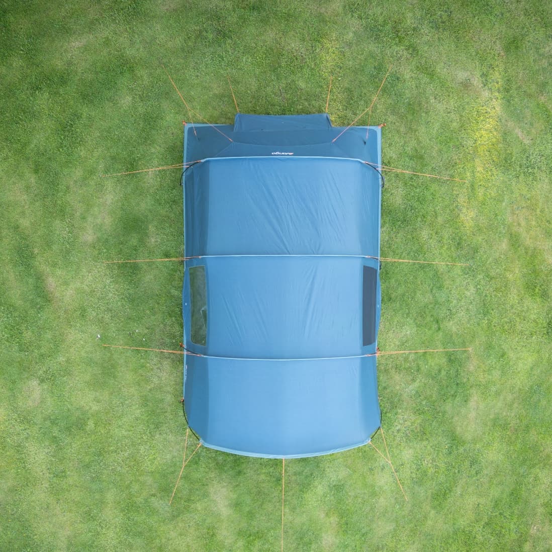 Top-down aerial view of the Vango Sierra 500 Poled tent set up on a grassy area, showcasing its full footprint and guyline placements.