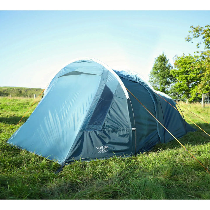 Vango Skye 300 tent fully pitched on grass with all doors closed, clear window panel and logo visible near the base.