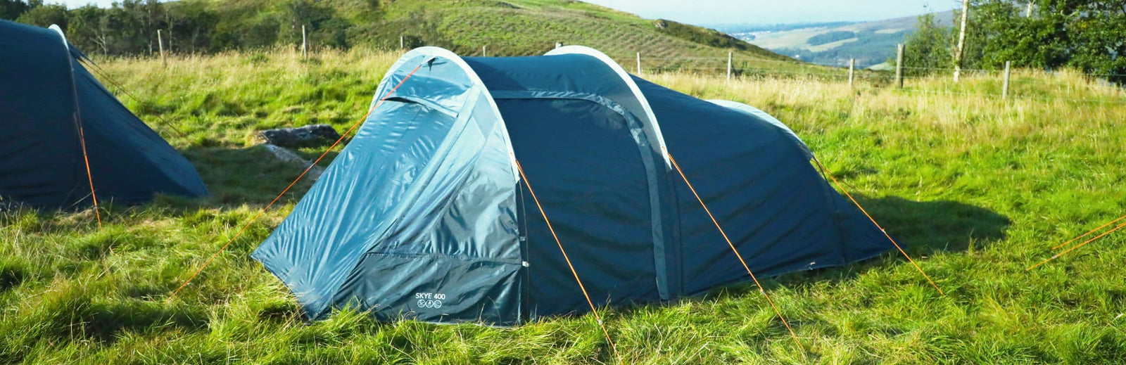 Scenic outdoor setup of the Vango Skye 400 Tent, a 4-person weekend tent blending into the natural surroundings, suited for camping trips and festivals