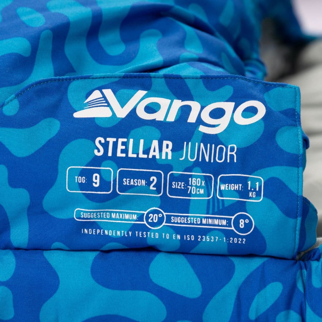 Product label of the Vango Stellar Junior children's sleeping bag detailing size, weight, and temperature ratings.