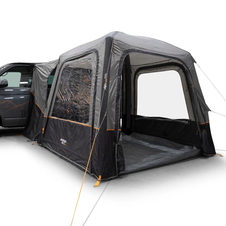 Vango Tailgate AirHub II Low Drive Away Awning attached to side of VW Campervan with awning front door open.