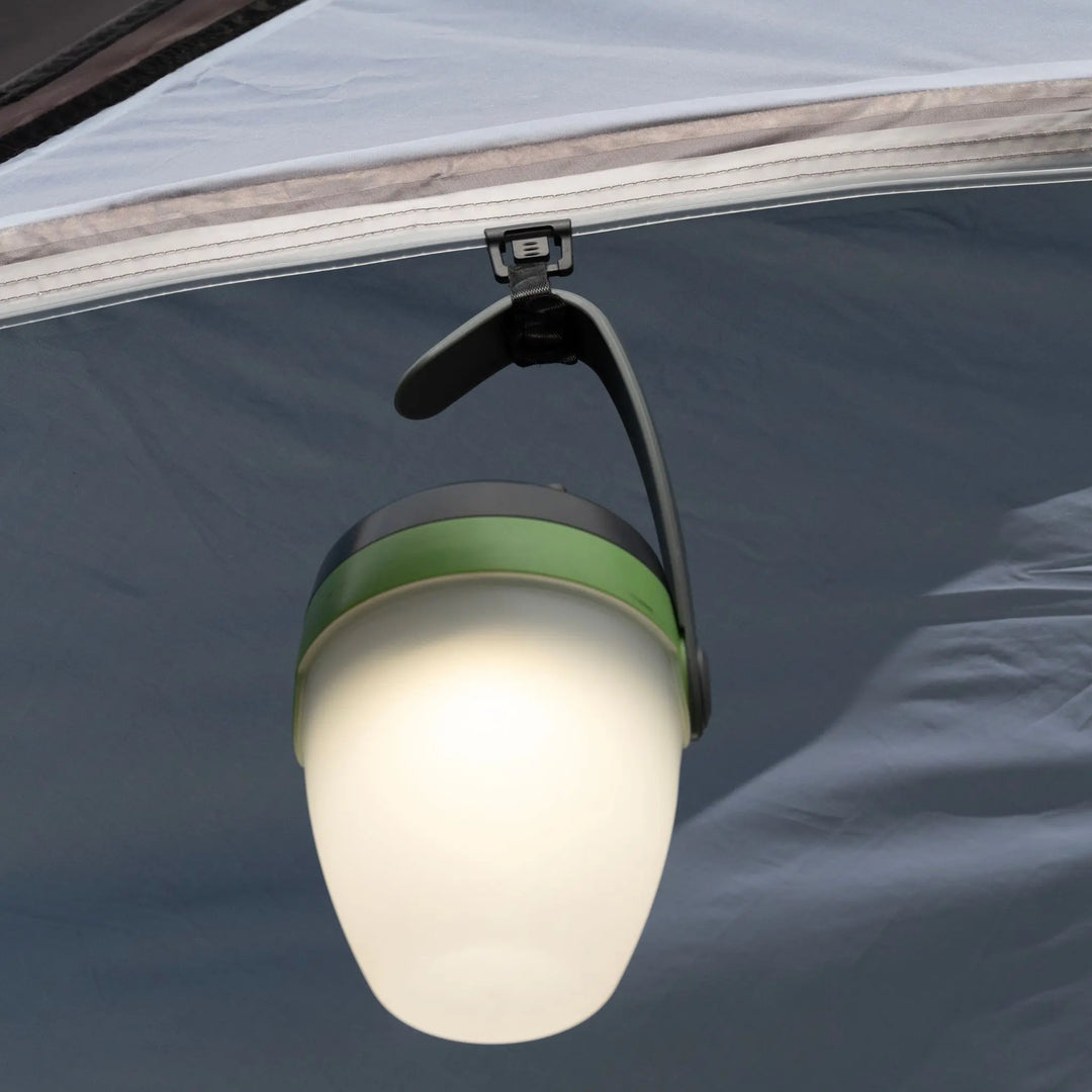 Close-up of a camping light hanging inside the Vango Tailgate Hub II Low awning, showing its SkyTrack II hanging system.