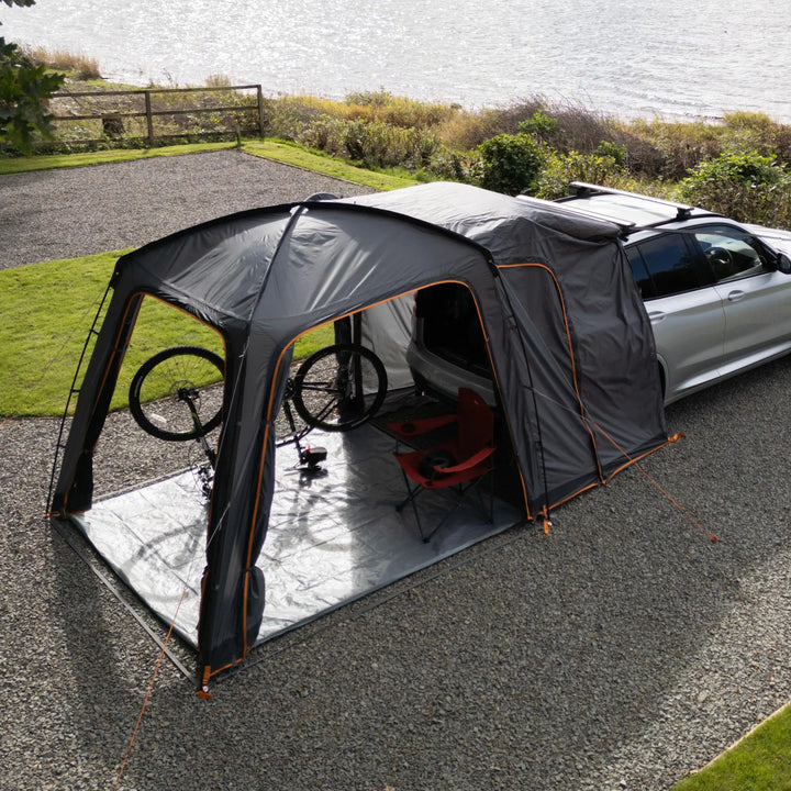 Front and side view of the Vango Tailgate Hub II Low awning, showing its structured design and compatibility with campervans for enhanced outdoor living.