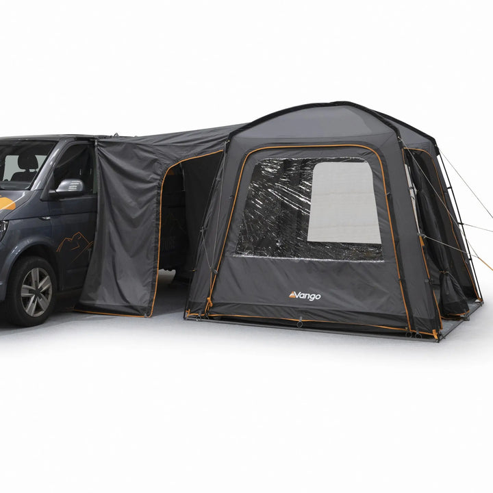 Side view of the Vango Tailgate Hub II Low Awning connected to the side of a campervan, highlighting its versatile setup.