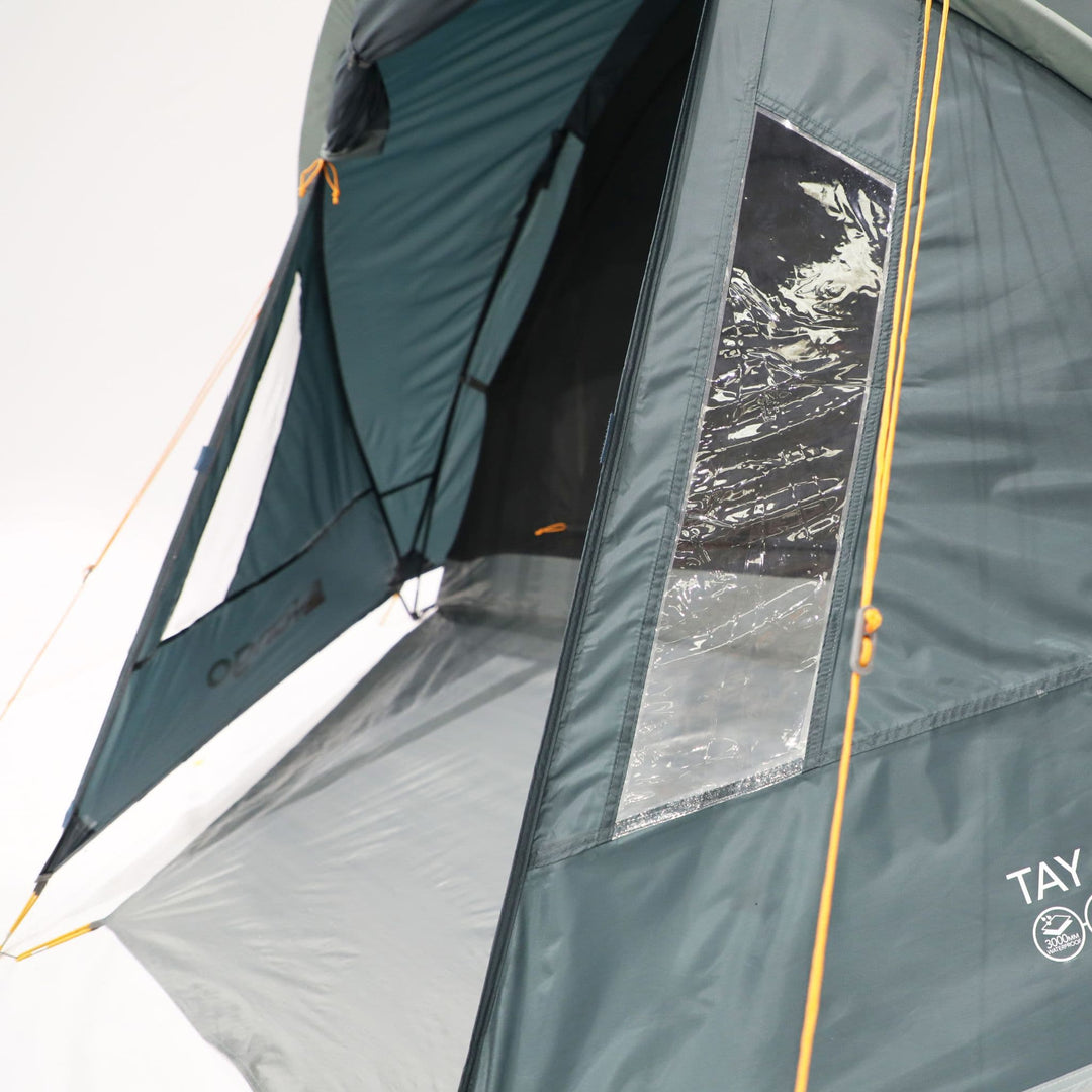 Close-up view of the Vango Tay 400 tent's entrance showing the partially open door with a mesh panel, ideal for ventilation at festivals and camping trips in a 4-man tent.