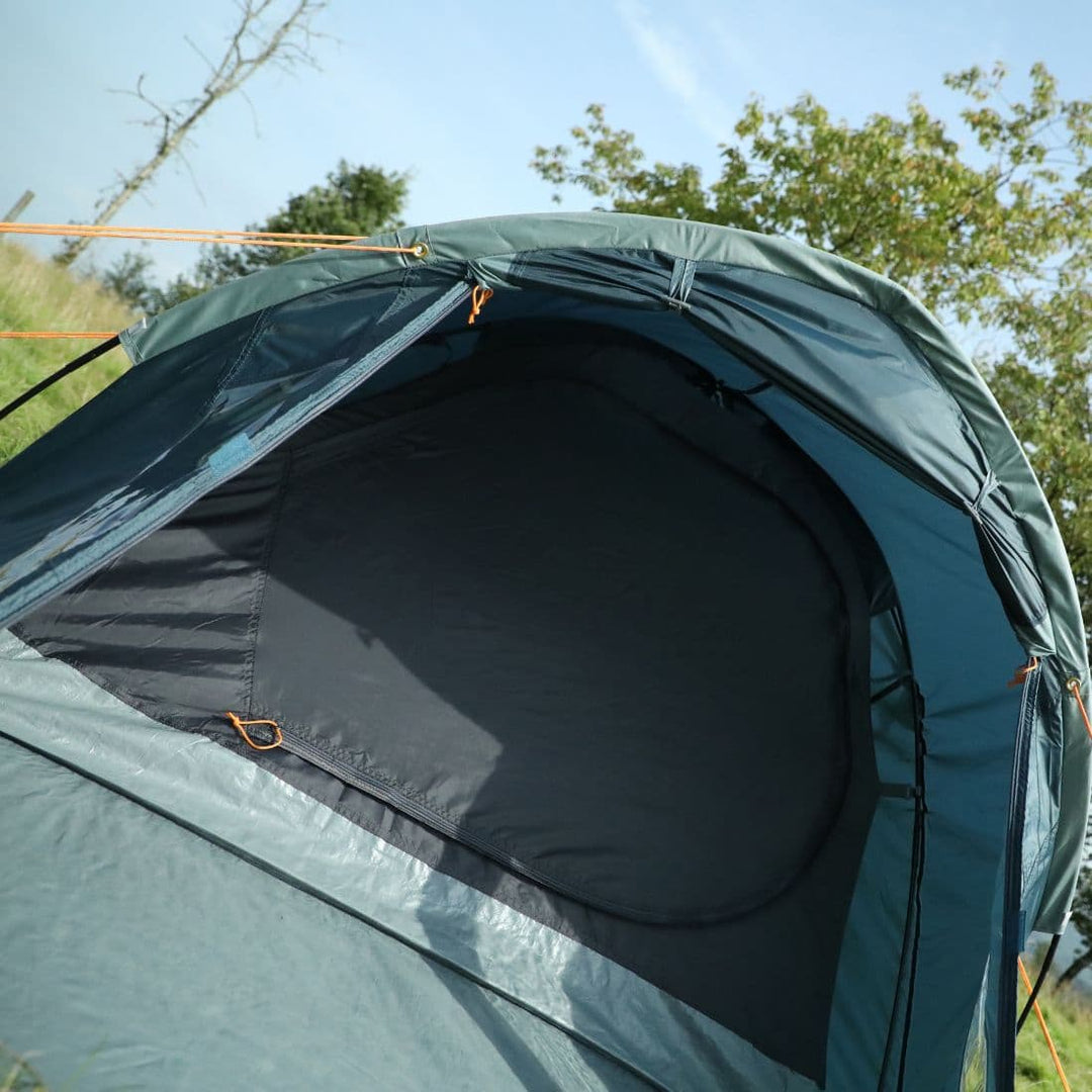 Close-up of the side panel and window of the Vango Tay 400 4 man tent, showcasing its weather-resistant design, ideal for festivals.