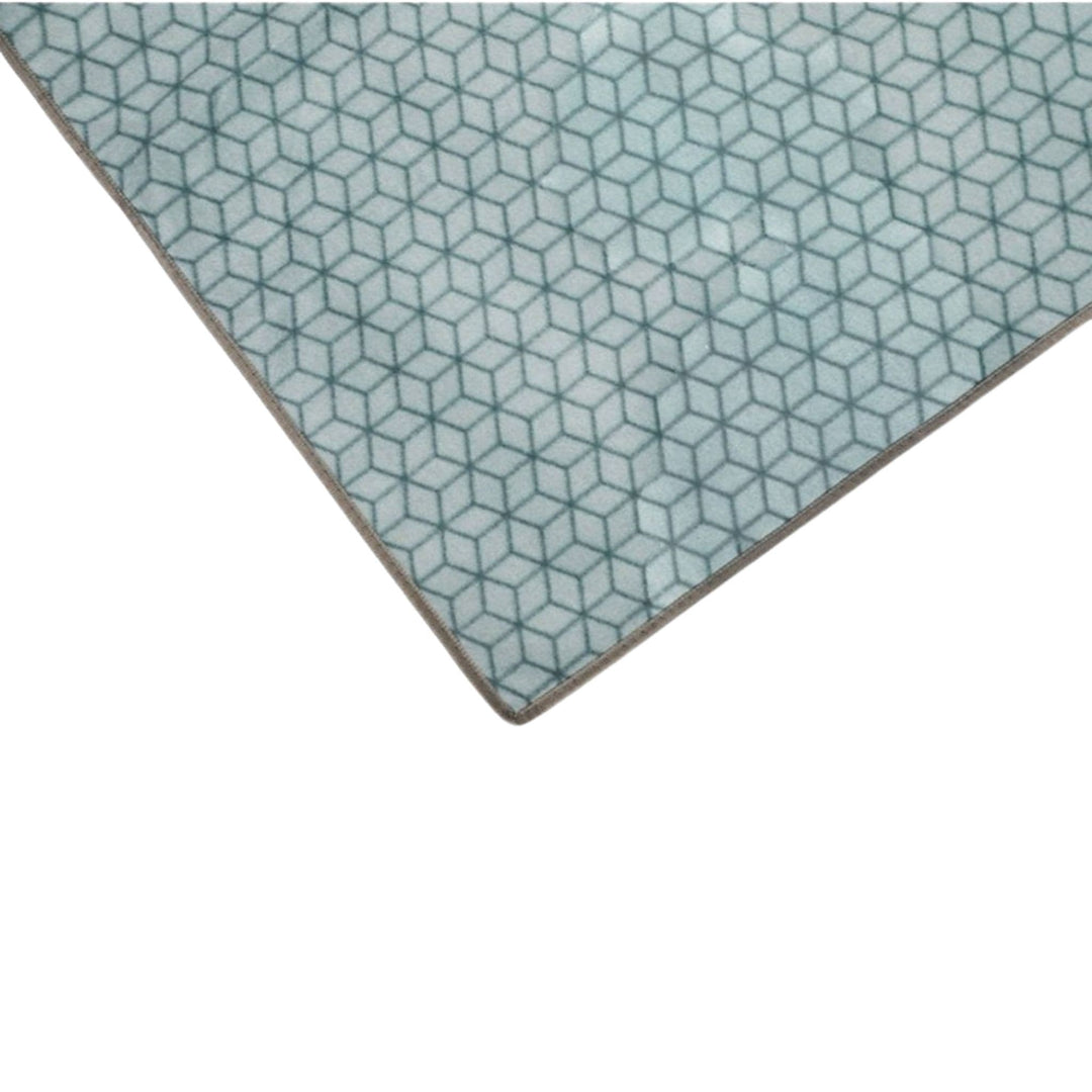 A corner of a Vango Universal carpet with a geometric pattern, designed for use with a tent.
