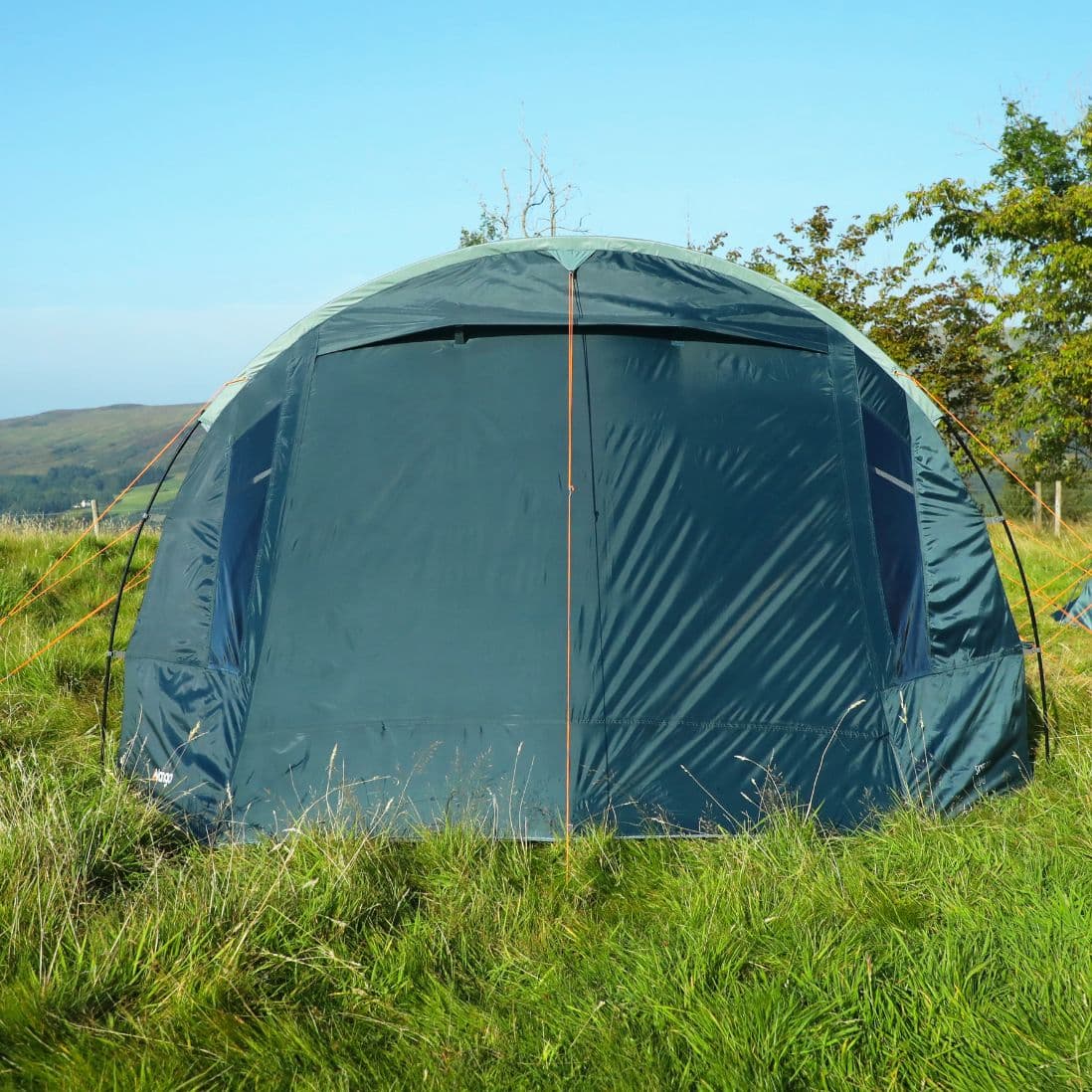 Side view of the Vango Skye 500 tent set up at a festival campsite.