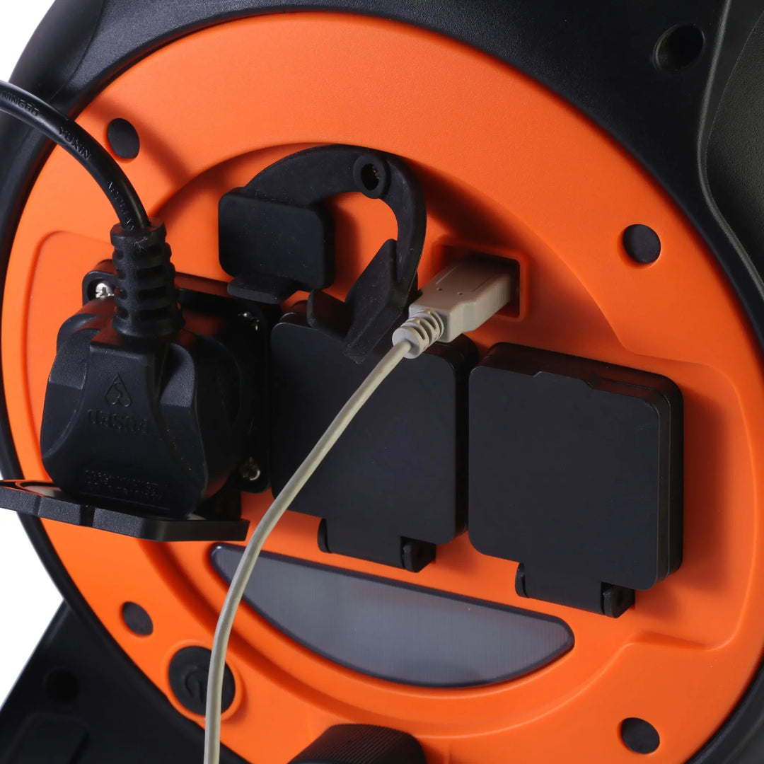 Vango Voltaic Roll Away Mains Unit in use with power plugs and USB devices connected.