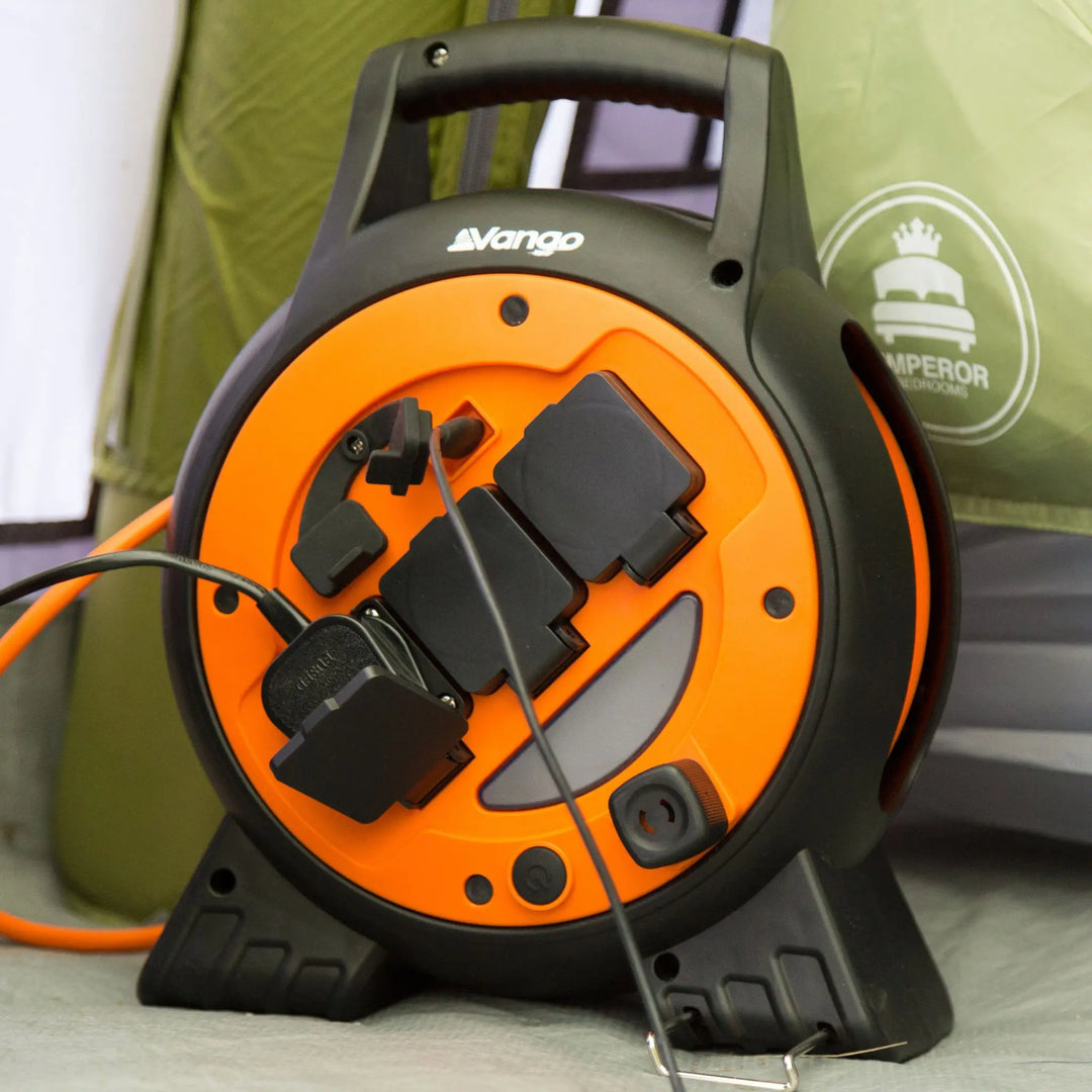 Vango Voltaic Roll Away Mains Unit providing power inside a tent during a camping trip.